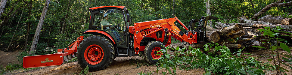 Kubota compact tractor in a forest